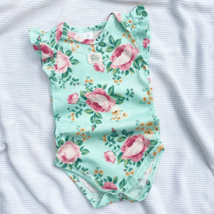 Body Volado Flor Fuxia